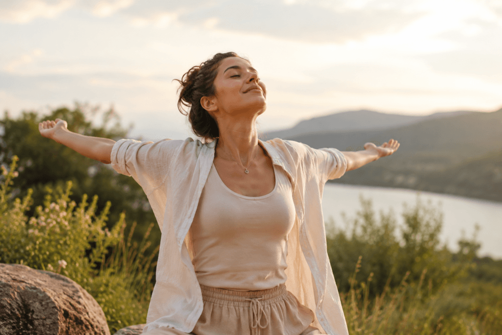 Woman releasing tension outdoors representing emotional release from bottling up emotions