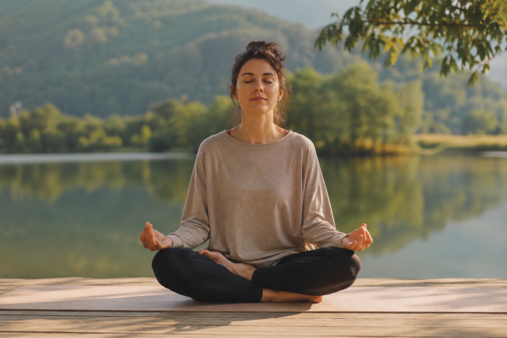 Person meditating calmly without focusing on breathing, eyes closed in peaceful setting